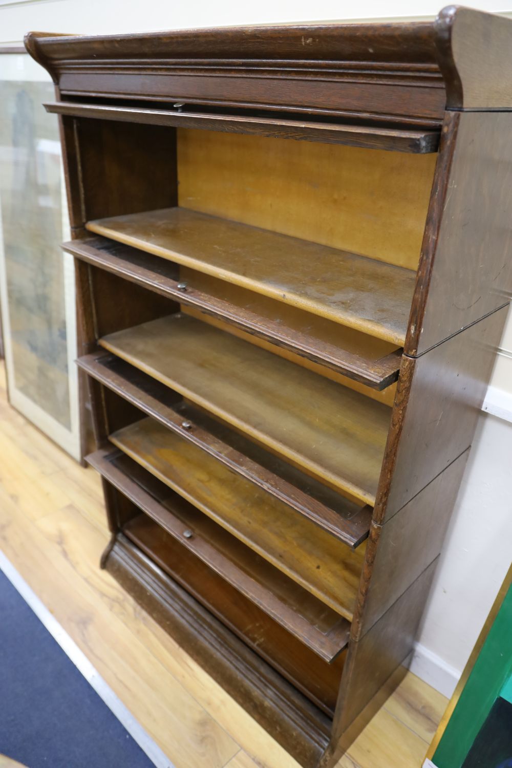 An early 20th century oak Globe Wernicke-style oak four section bookcase, width 87cm depth 36cm height 140cm